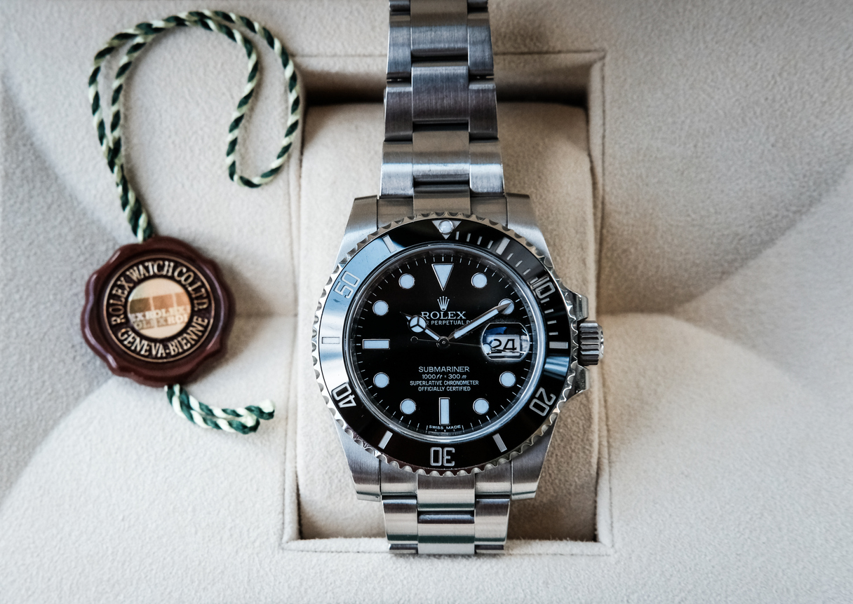 How much do the box and papers affect the value of a luxury watch?
