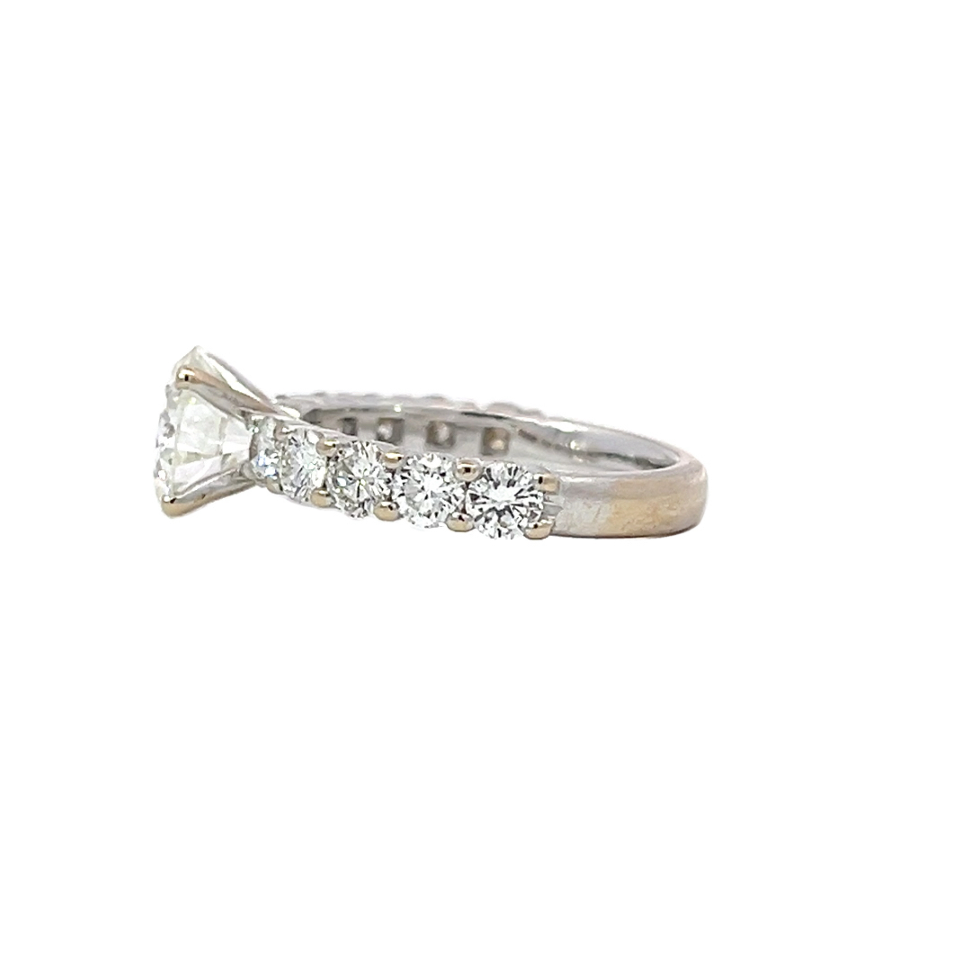 Elegant 3.69g Gold Ring with 1.67ct Center Stone and Five Accent Stones on Each Side.jpeg